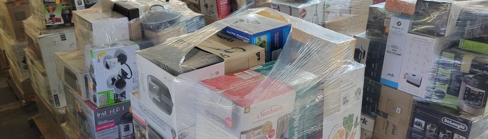 Wrapped pallets of boxed merchandise shown on the Great Buys company profile
